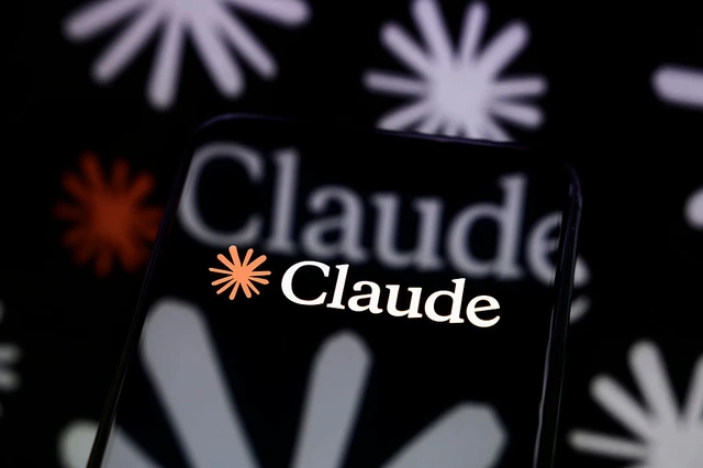 Claude logo displayed on a smartphone screen against a reflective surface